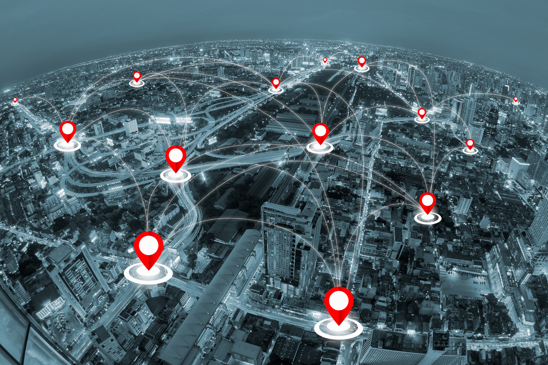 location markers in red on cityscape joined together like a network